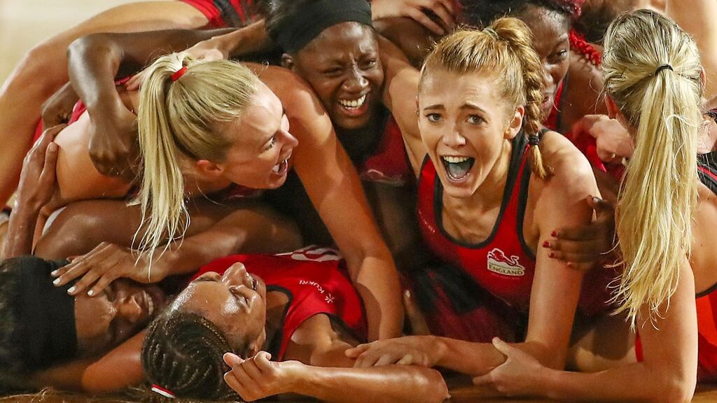 Helen Housby, who scored in the final second, and her England netball team-mates celebrate at full-time after defeating Australia to win the gold medal at the Commonwealth Games. Photograph: Scott Barbour/Getty Images