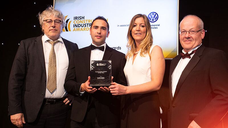 Michael Moriarty, Director, 3D Personnel presents the Conservation Project of the Year award to the Stewart Construction team.