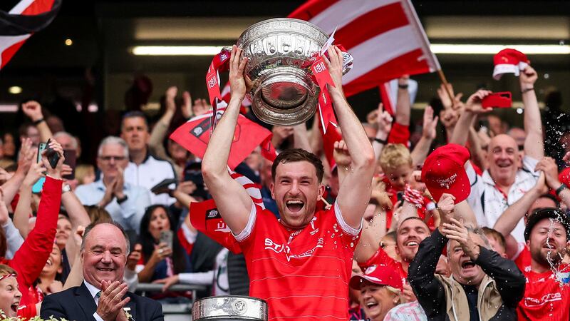 Sam Mulroy lifts the Delaney Cup after Louth's Leinster final victory. Photograph: James Crombie/Inpho