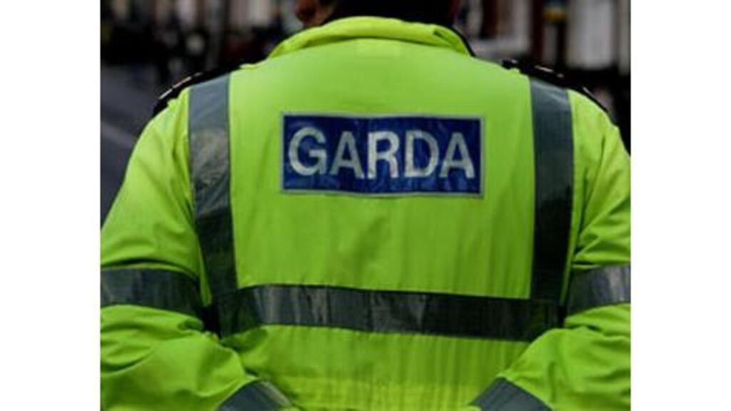 Two men armed with knives entered the house through the front door and threatened the woman.