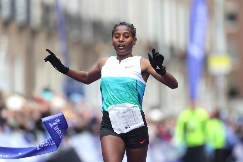 Ethiopia's Eebbissee Addunyaa crosses the line to win the women's race. Photograph: Bryan Keane/Inpho
