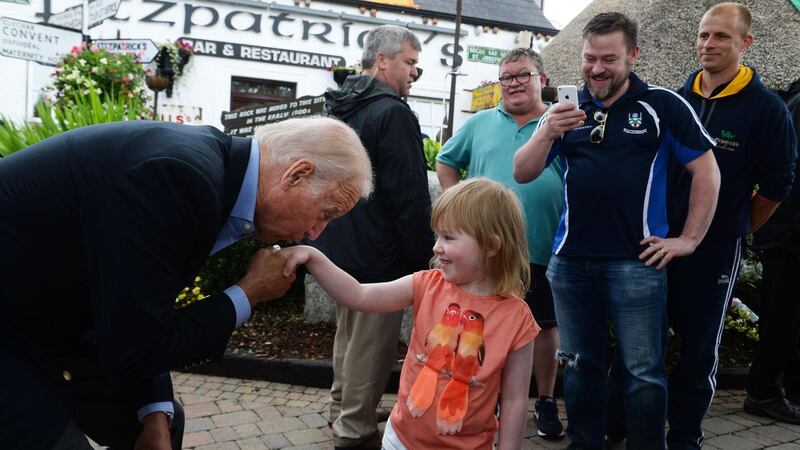 Shane Brennan from Lordship watches his daughter Aoibheann Brennan as she meets US vice president Joe Biden at Fitzpatricks Pub & Restaurant in Jenkinstown, Co Louth on Saturday. Photograph: Cyril Byrne/The Irish Times