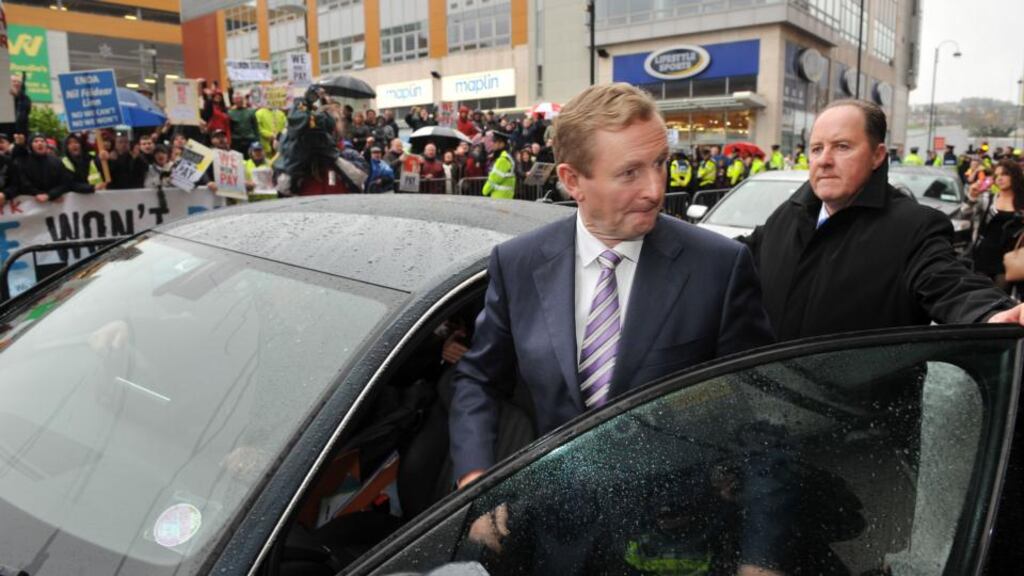 Taoiseach Enda Kenny is heckled as he arrives at Xanadu’s offices in Cork this morning. Photograph: Daragh McSweeney/Provision
