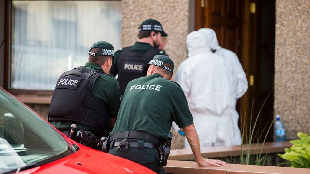 PSNI officers and British army technical officers search properties in Larne, Co Antrim on August 24th after the arrest of Royal Marine Ciaran Maxwell by detectives investigating Northern Ireland-linked terrorism. Photograph: Liam McBurney/PA Wire