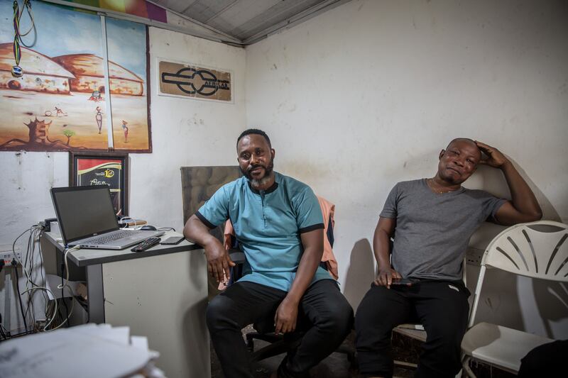 Samuel Darko (left), the chief executive of Kumawood TV, in his office in Kumasi with a colleague. He has been working in the industry for 25 years, acting in films, TV series, and advertisements, as well as writing scripts, editing, filming and directing. Photograph: Sally Hayden