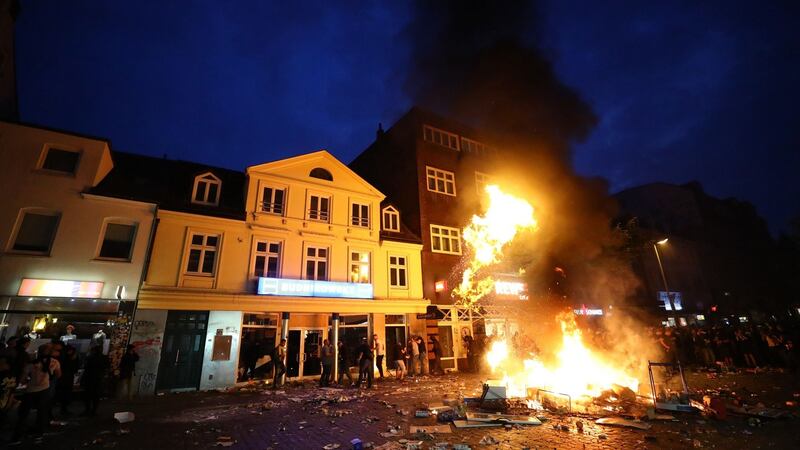 Barricades burn as people loot the shop during the protests at the G20 summit in Hamburg, Germany. Photograph: REUTERS/Kai Pfaffenbach