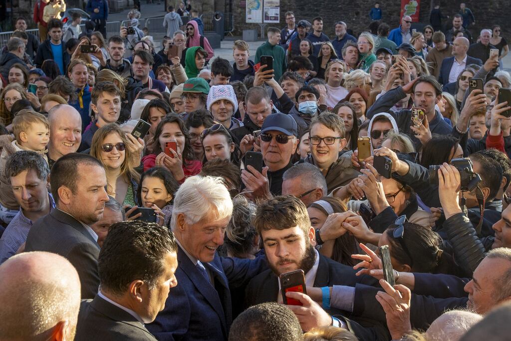 Former US president Bill Clinton poses for selfies in Guildhall Square after giving a speech in the Guildhall in Derry. Photograph: Liam McBurney/PA