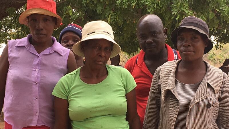 Phonny Marange (red) and Georgina Zomba (green) travelled to a pick-up station run by WFP and Goal in Mutare district, Manicaland province in late November to get a free monthly food basket. Photograph: Bill Corcoran