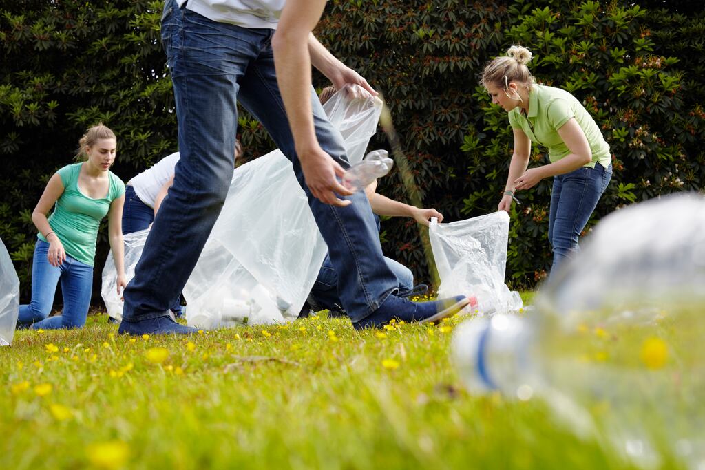Litter picking in local woods is one way Schneider Electric employees are getting involved with their local community. Photograph: Getty Images