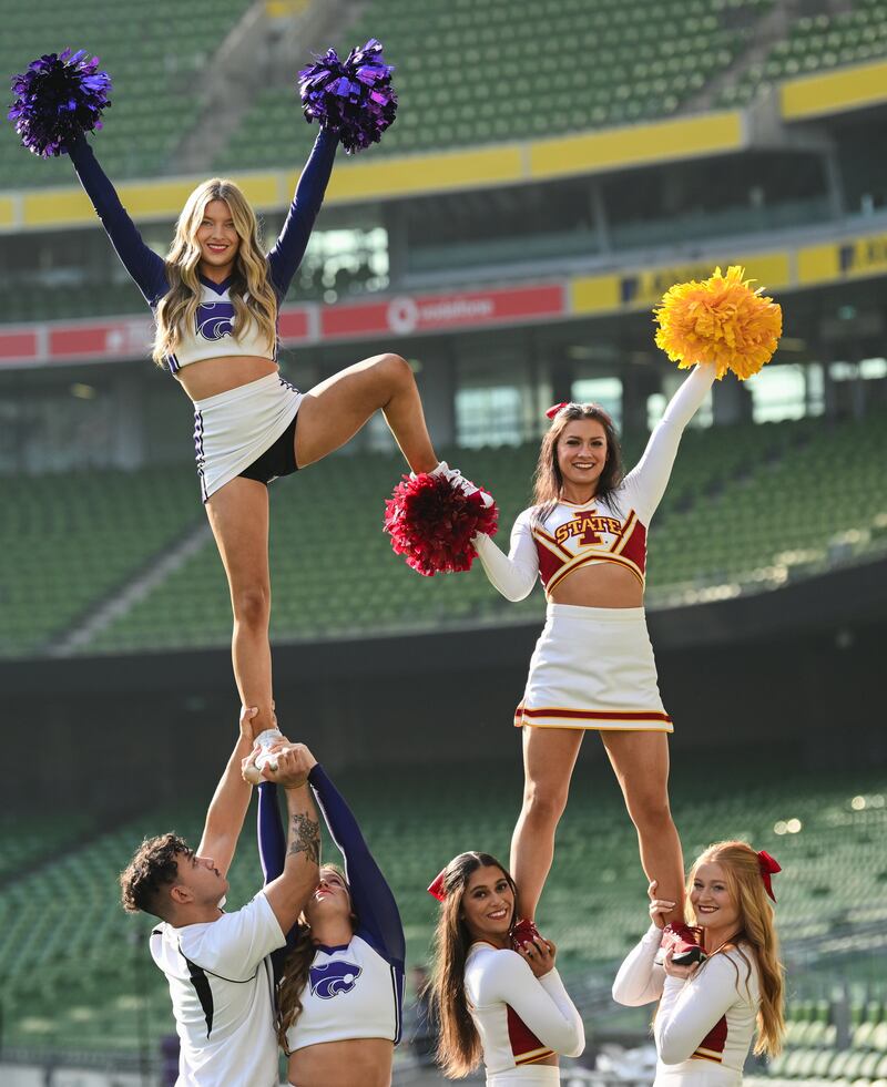 Kansas State University and Iowa State University Cheerleader members at the Aviva Stadium Dublin. Photograph: Ramsey Cardy/Sportsfile