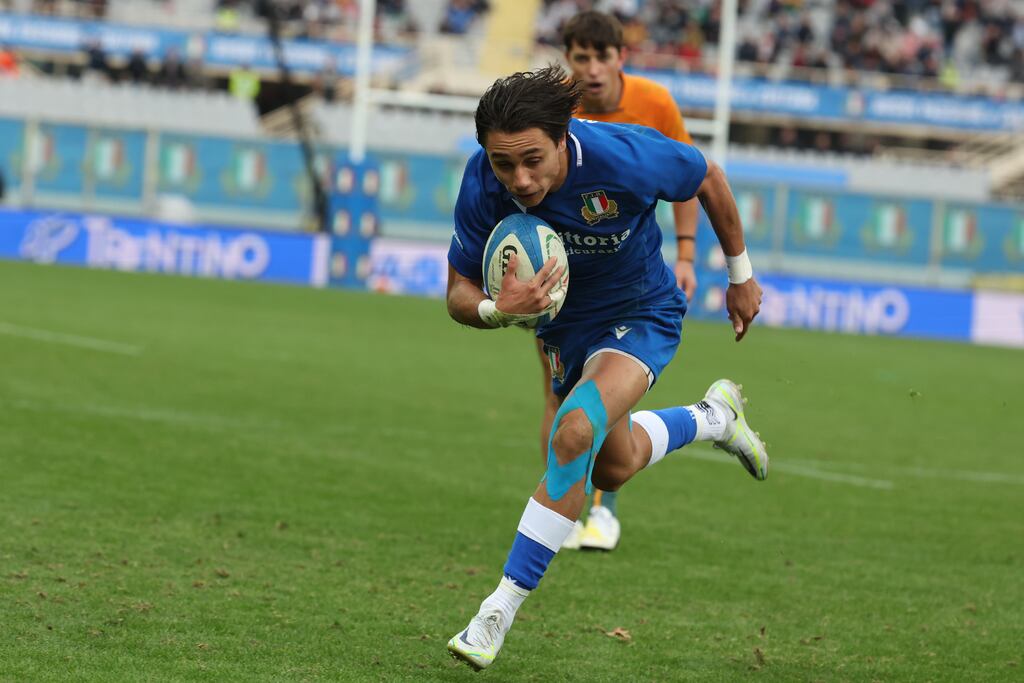 Italy’s Ange Capuozzo goes for the try against Australia. Photograph: Giuseppe Fama/Inpho