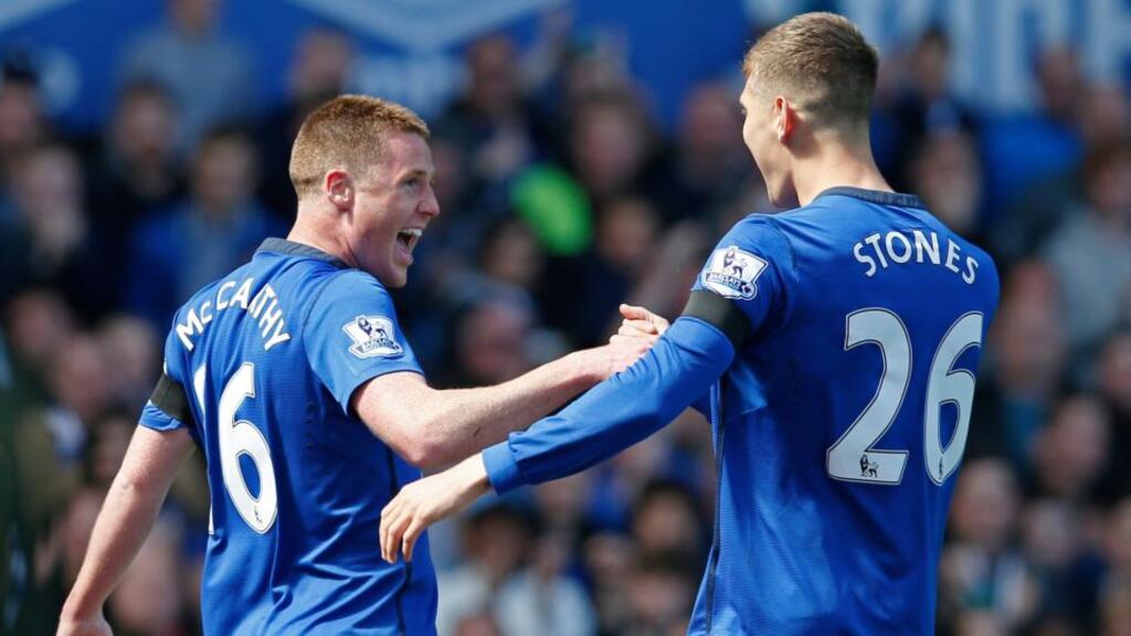 Everton midfielder James McCarthy celebrates his goal against Manchester United with John Stones, who later scored his first goal for the club in the Premier League encounter. Photo: Paul Ellis/AFP