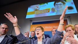 Merkel’s conservatives win regional  vote in boost for national campaign