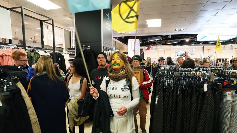 Extinction Rebellion protestors demonstrate in Penneys. Photograph: Brian Lawless/PA Wire
