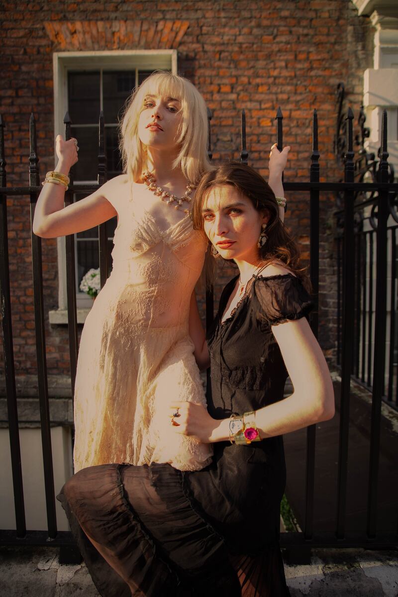 Francis O'Mahony wears a satin and lace sheer gown, €85, and bloomers, €35, from Victorian Romance Collections; bangles €18-25, rings €28, multi-string pearl necklace €45. Liath Hannon wears a vintage black chiffon dress, €75, and bloomers, €38, from Om Diva. Pearl and pendant necklace from Saltwater Designs. Bangles, Magpie Rose, €90; glass bangles €45 from McGonigle Glass Studios