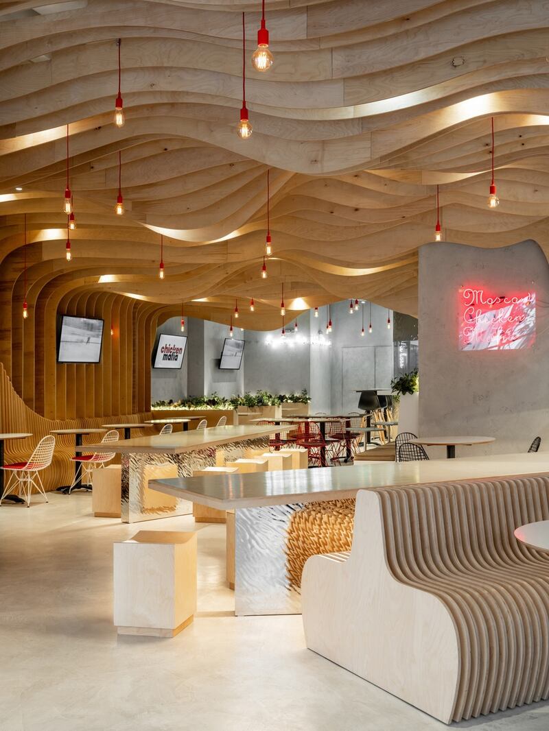Greta Project delivered a different sort of undulating ceiling using plywood waves in its look for Chicken Mafia, a restaurant in Moscow.