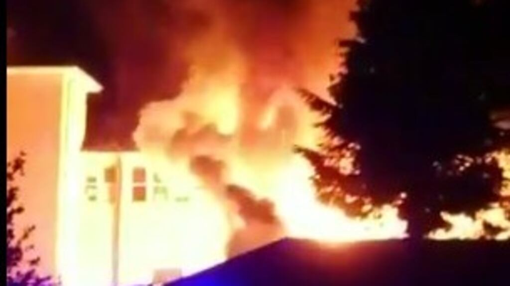 An image showing the fire at St Louis Secondary School in Dundalk, Co Louth on Saturday. A prefab building was destroyed but the school will open on Monday. Image: LMFM via Twitter