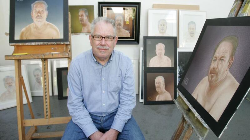 Robert Ballagh with a series of self-portraits at his studio in Stoneybatter. Photograph: Alan Betson