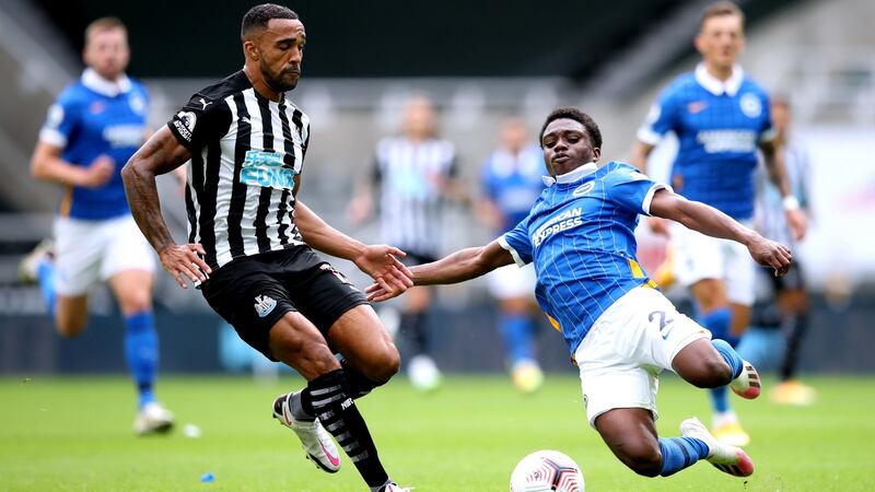 Tariq Lamptey slides to tackle Newcastle’s Callum Wilson. Photograph: Alex Pantling/PA