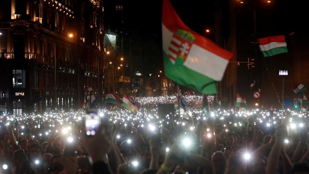 People attend a protest against the government of prime minister Viktor Orban in Budapest, Hungary. Photograph: Bernadett Szabo/Reuters