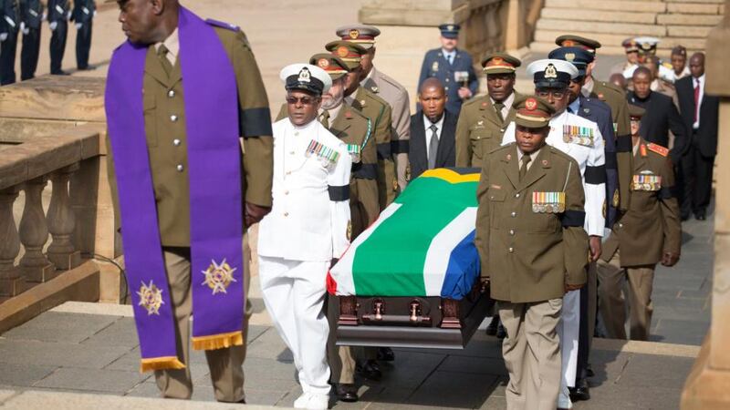Military officers carry the coffin of Nelson Mandela to the Union Buildings marking the start of the three-day lying in state. Photograph: EPA/Marco Longari/Pool