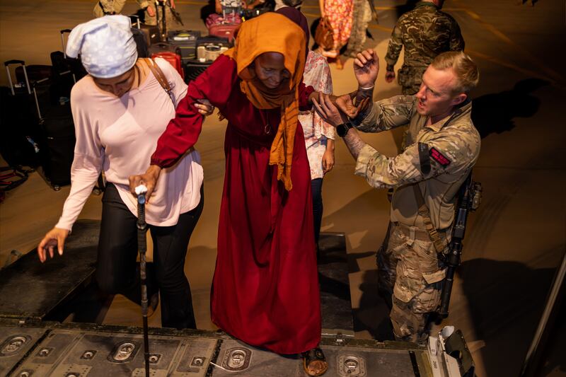 People boarding an aircraft at RAF Akrotiri in Cyprus, after being evacuated from Sudan. Photograph: Ministry of Defence/PA Wire