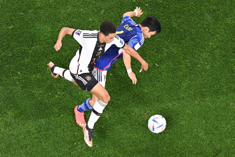 Germany's Jamal Musiala fights for the ball with Japan's Wataru Endo. Photograph: Antonin Thuillier/AFP via Getty Images)