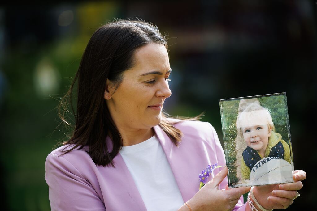 Marie Kealy with a photo of her daughter Hannah. Photograph: Andres Poveda