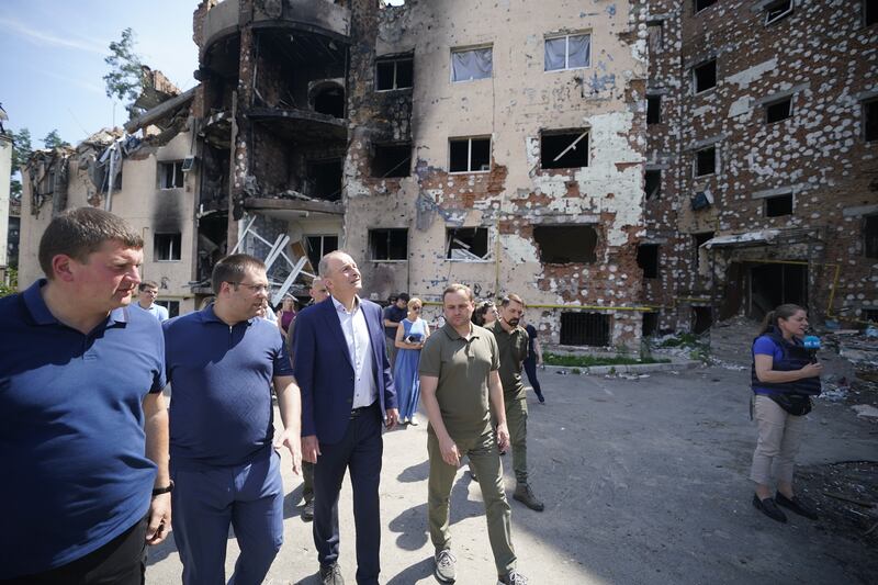 Taoiseach Micheál Martin with local officials viewing the damage to the city of Irpin. Photograph: PA Images