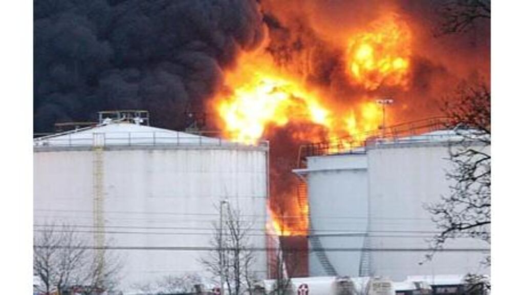 Smoke billows into the air from the oil depot at Buncefield in Hemel Hempstead, Hertfordshire. Firefighters yesterday had to suspend efforts to extinguish the blaze, which erupted on Sunday. Photograph: Chris Young/PA