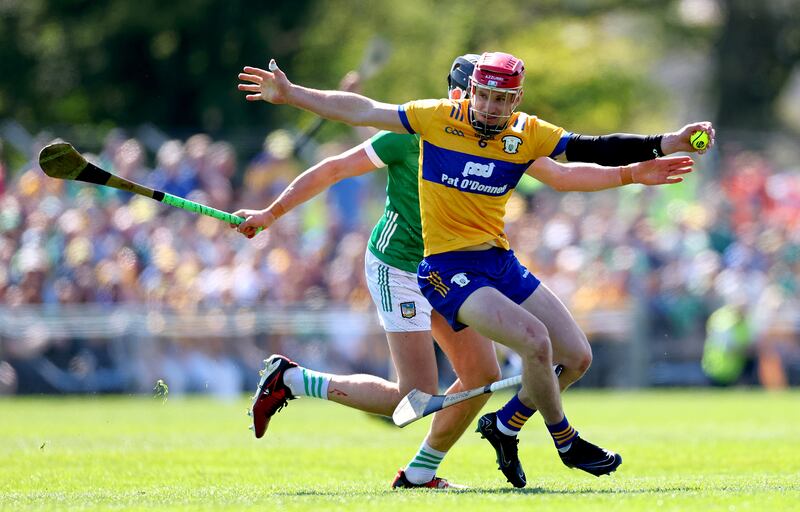 Limerick’s Gearóid Hegarty and John Conlon of Clare in a tussle for possession during the game. Photograph: James Crombie/Inpho