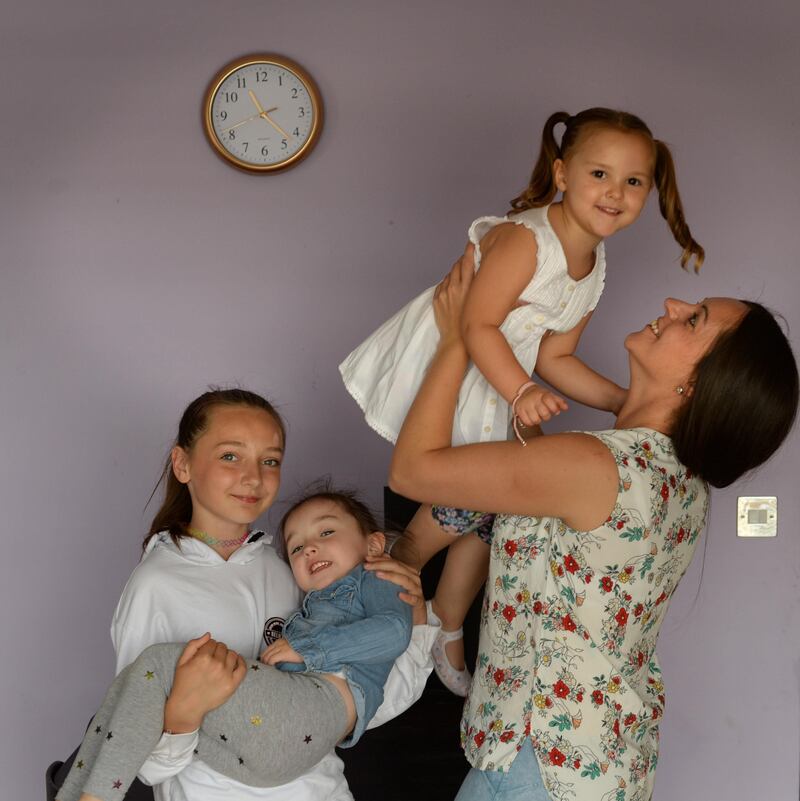 Sarah Conway with her children Kyra (11), Amelia (4) and Hallie (3) at home in Cork Street, Dublin. Photograph: Dara Mac Dónaill