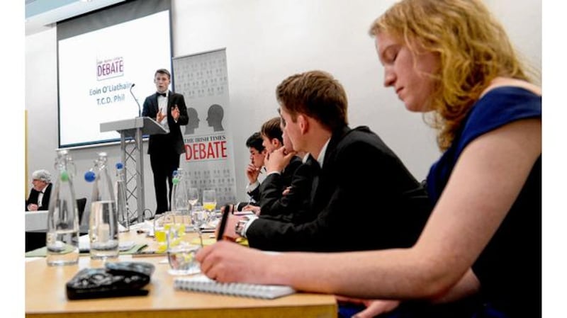 Proposition lead speaker Eoin O'Liathain opens the the motion at the Irish Times Debate Final in Queen's University's Riddel Hall. Photographs: charles mcquillan/pacemaker.