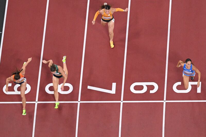 Ireland's Kate O'Connor (second left) crosses the line for second place, in a personal best time, that left her second overall after day one. Photograph: Antonin Thuillier/AFP