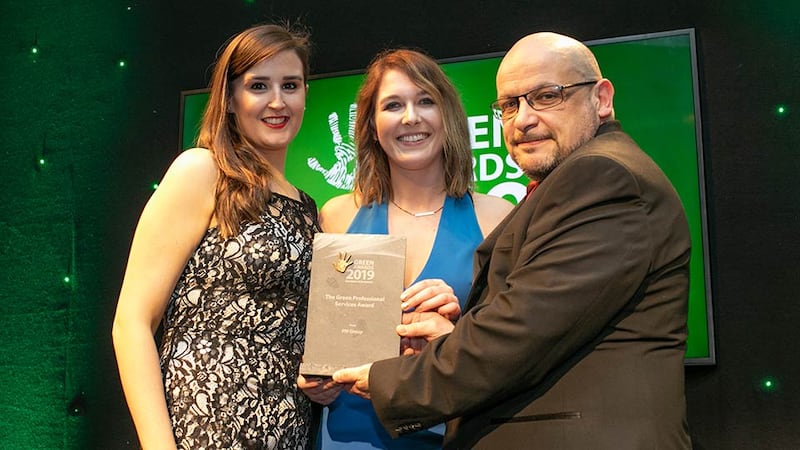 Lauren Stewart, Customer Relationship Manager, Naturgy presents The Green Professional Services Award to Aine Monaghan & Eddie O’Mahony, PM Group.