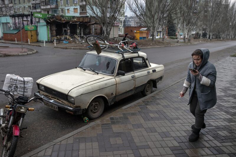 A civilian resident of Bakhmut, in eastern Ukraine, packs up to leave the city. It was not until December — after months of brutal artillery duels and deadly trench warfare — that Russian forces managed to enter the eastern outskirts of the city. Photograph; Tyler Hicks/The New York Times