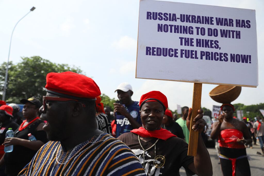 Protesters hold placards on the second day of a demonstration over soaring living costs in Accra, Ghana. Photograph: Nipah Dennis / AFP via Getty