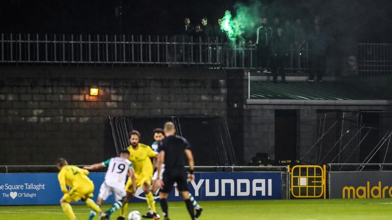 Shamrock Rovers supporters watch the Europa League first qualifying round against Ilves Tampere from a wall at Tallaght Stadium. Photograph: Ryan Byrne/Inpho