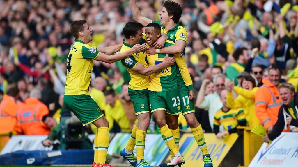 Martin Olsson (2nd R) of Norwich City celebrates scoring his team’s third goal with his team mates during the Barclays Premier League match between Norwich City and Newcastle United at Carrow Road Photograph: Dan Mullan/Getty Images