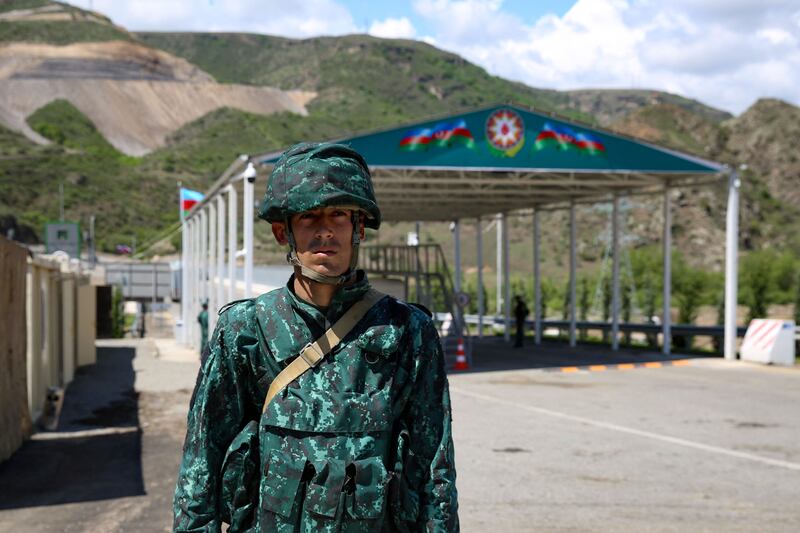 An Azerbaijani checkpoint at the entry of the Lachin corridor. Azerbaijan says the checkpoints and roadblocks are necessary to stop weapons being smuggled into Nagorno-Karabakh. Photograph: Tofik Babayev/AFP via Getty Images