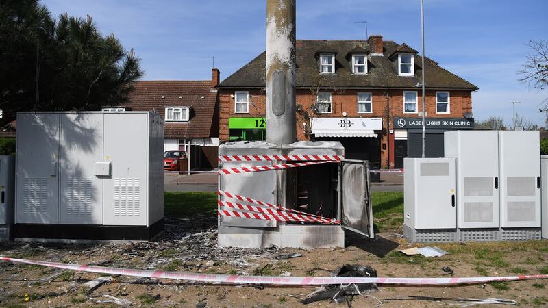 A burned-down mobile phone mast in London. Photograph: Facundo Arrizabalaga/EPA