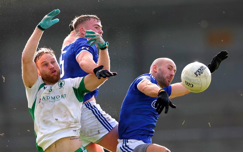 Killoe’s Paddy Kiernan with Jack Geoghegan and Peter Foy of St Lomans. Photograph: James Crombie/Inpho