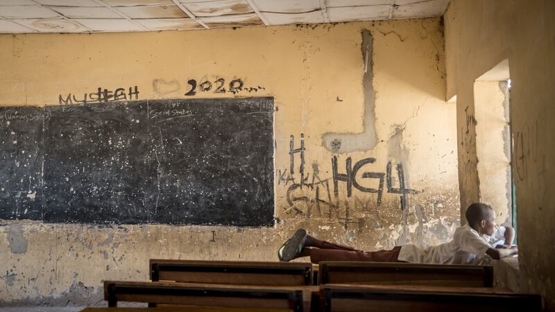 A boy rests in an empty classroom in Maiduguri, northeast Nigeria. Photograph: Sally Hayden