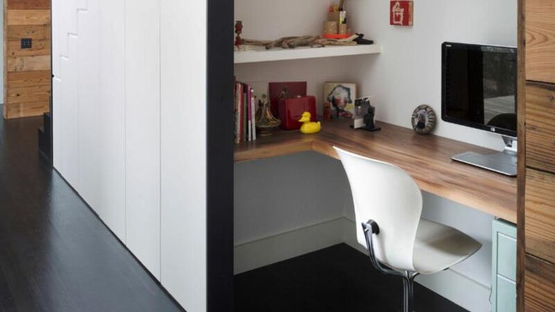 The untapped space under the stairs can be transformed into a home office.