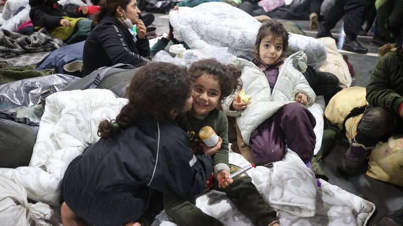 Migrants at the transport and logistics centre near the Bruzgi border point on the Belarusian-Polish border in the Grodno region. Photograph: Leonid Shcheglov/Belta/AFP via Getty