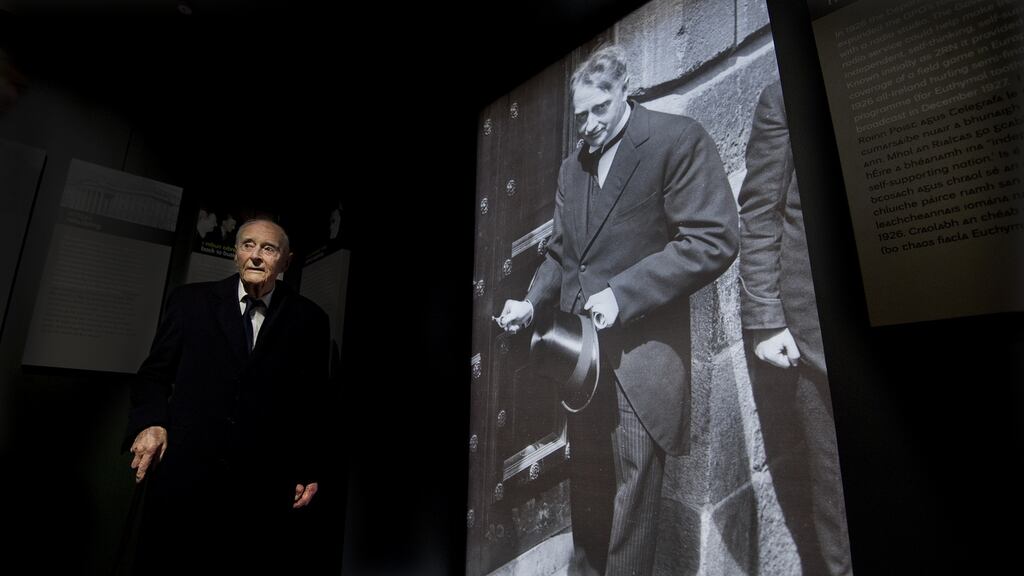Former taoiseach Liam Cosgrave stands in front of a photograph of his father WT  Cosgrave at the GPO Witness History Visitor Centre during its official opening in 2016. Photograph: Brenda Fitzsimons / THE IRISH TIMES
