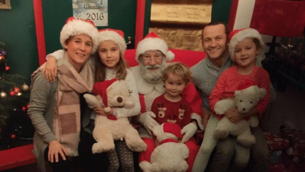 James Parnell with his family: Hoping to have the best of both worlds this Christmas.