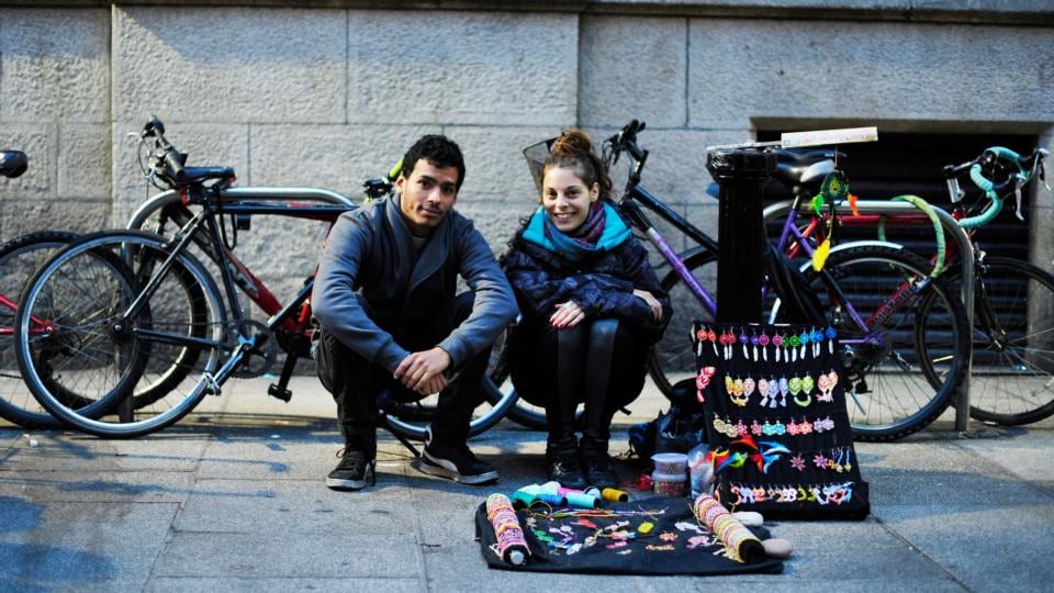 7.40pm: Juan Manuel Paniagua and Melody Padula, who sell macrame. Photograph: Aidan Crawley