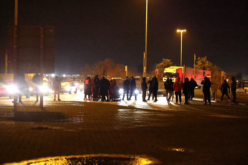 A night protest in Ballymun in January 2023 against immigration. Traffic was blocked traffic at the Ballymun exit to the M50. Photograph: Dara Mac Dónaill