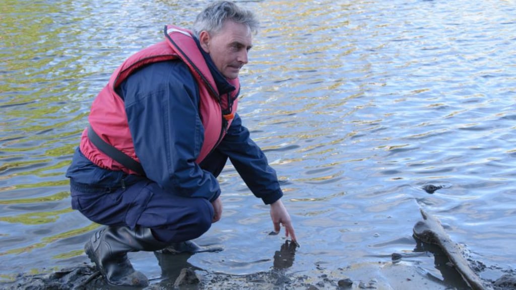 Sean Cahill of the Boyne Fishermen’s Rescue and Recovery Service beside the log boat. Photograph: BFRRS